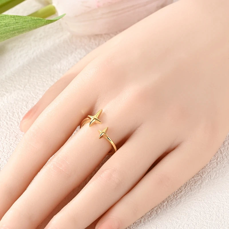 Anillos abiertos de plata con delfín y doble estrella