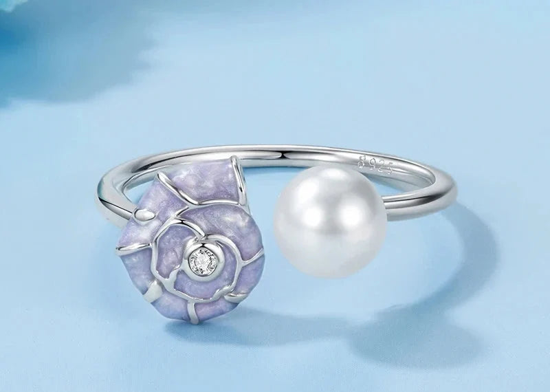 Silver open ring with shell and pearl details